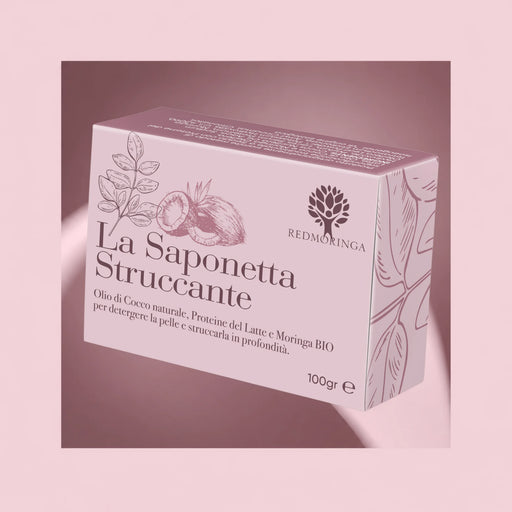 Savon démaquillant naturel RedMoringa à l'huile de coco, protéines de lait et Moringa bio, boîte de 100 g sur fond rose